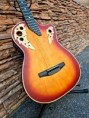 /album/fotogaleria-ukuleles-monterrey-fundas/guitarra-electroacustica-naranja-ovation-jpg/